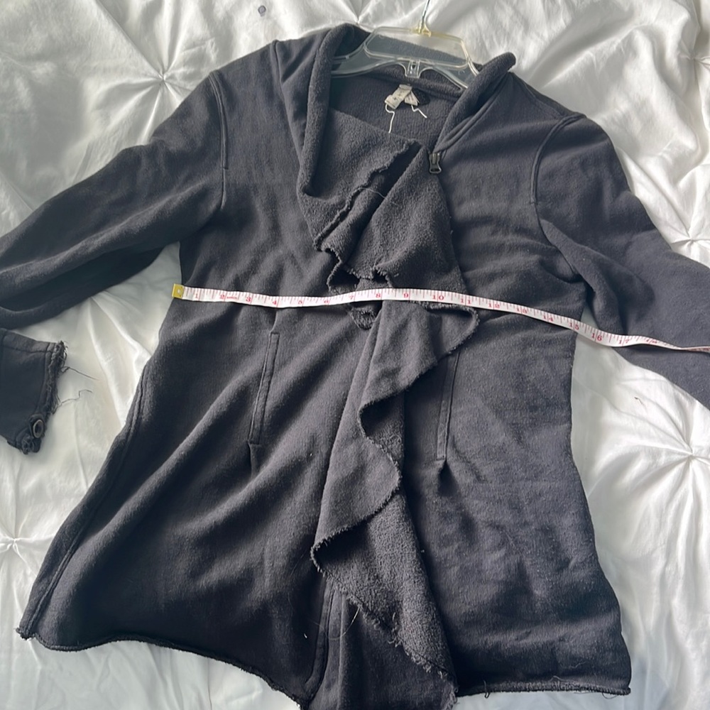 We the free zip up sweatshirt. Size L but fits more like a medium.